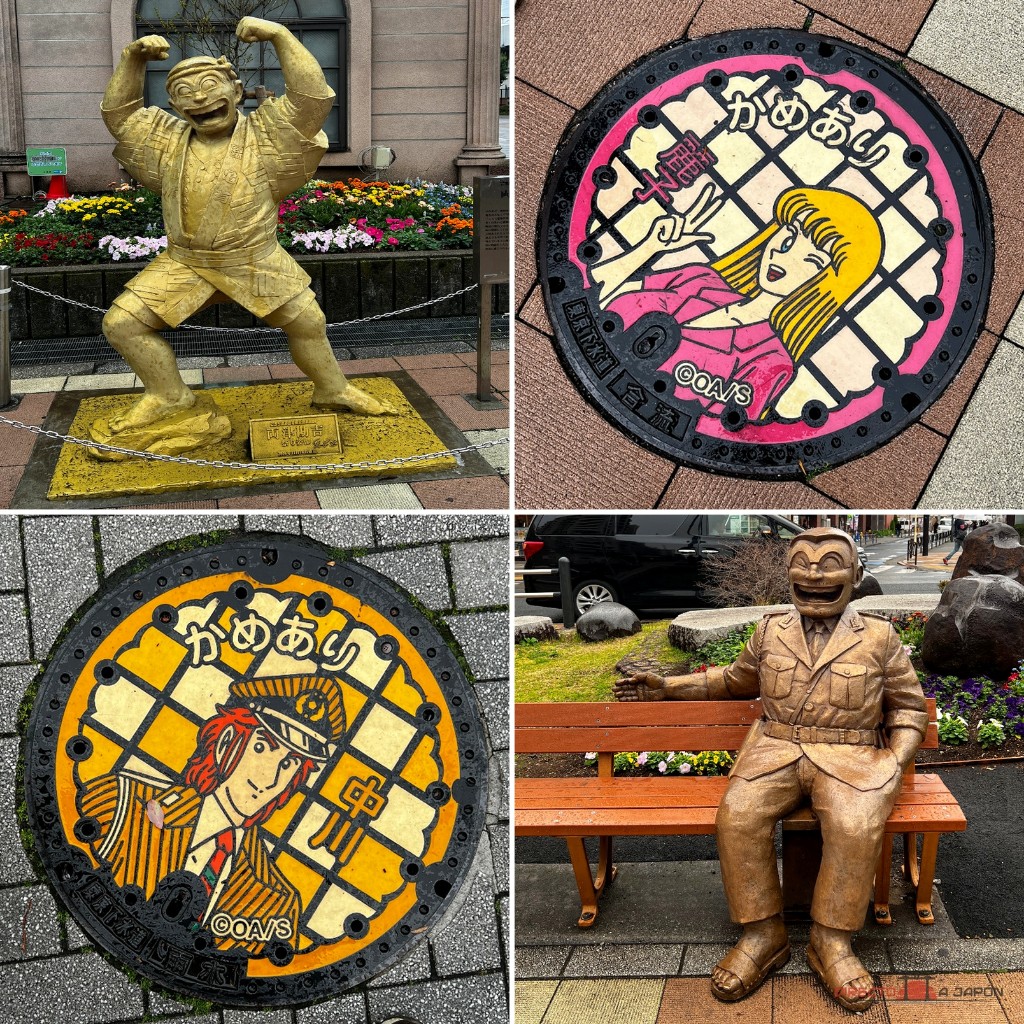 Estatuas y tapas de Kochikame: Nakagawa en amarillo y Reiko en rosa, junto a dos versiones de Ryotsu.