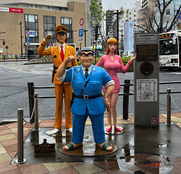 Ryotsu, Nakagawa y Reiko reciben a los visitantes junto a la salida sur de Kameari.