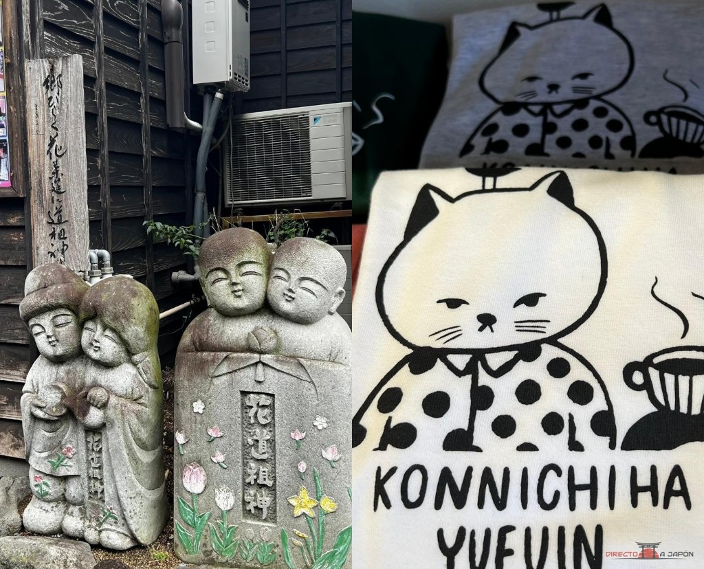Estatuas dōsojin junto a una casa de madera y camisetas con el gato de "Konnichiha Yufuin".
